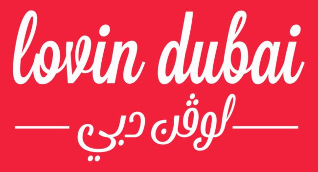 Red background with Lovin Dubai text in English and Arabic, showcasing a stylish font.